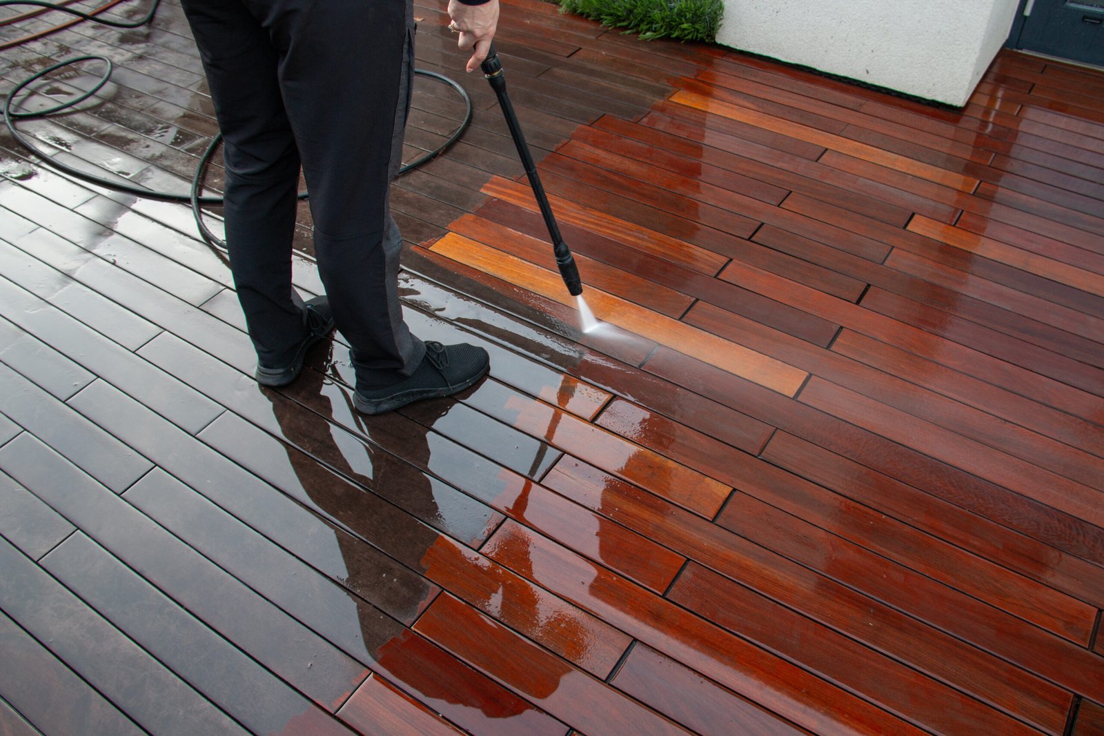 deck pressure washing with a power washer, wood planks cleaning